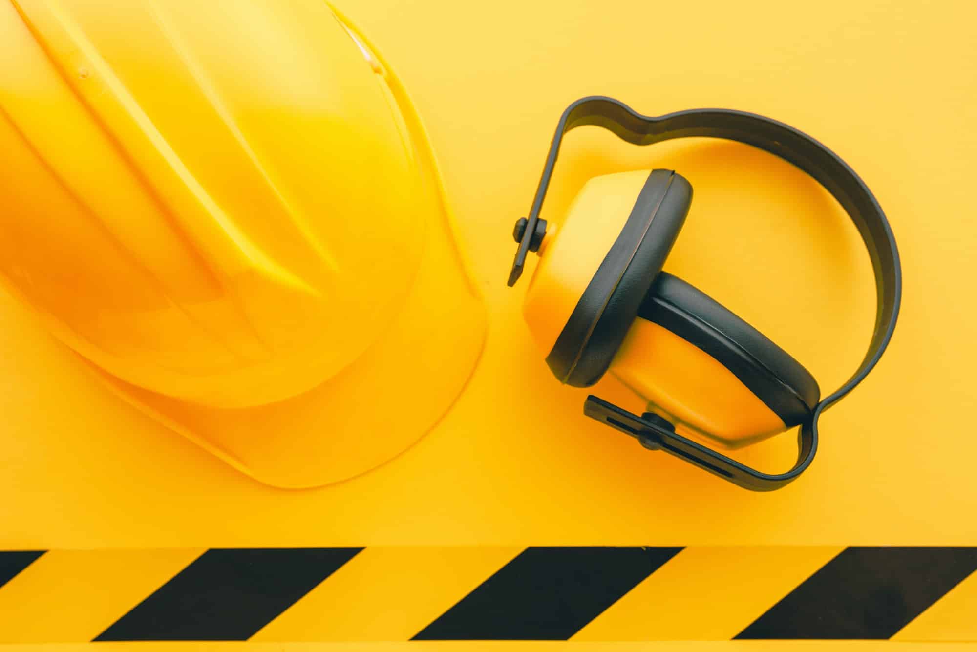 Protective construction helmet and earmuffs